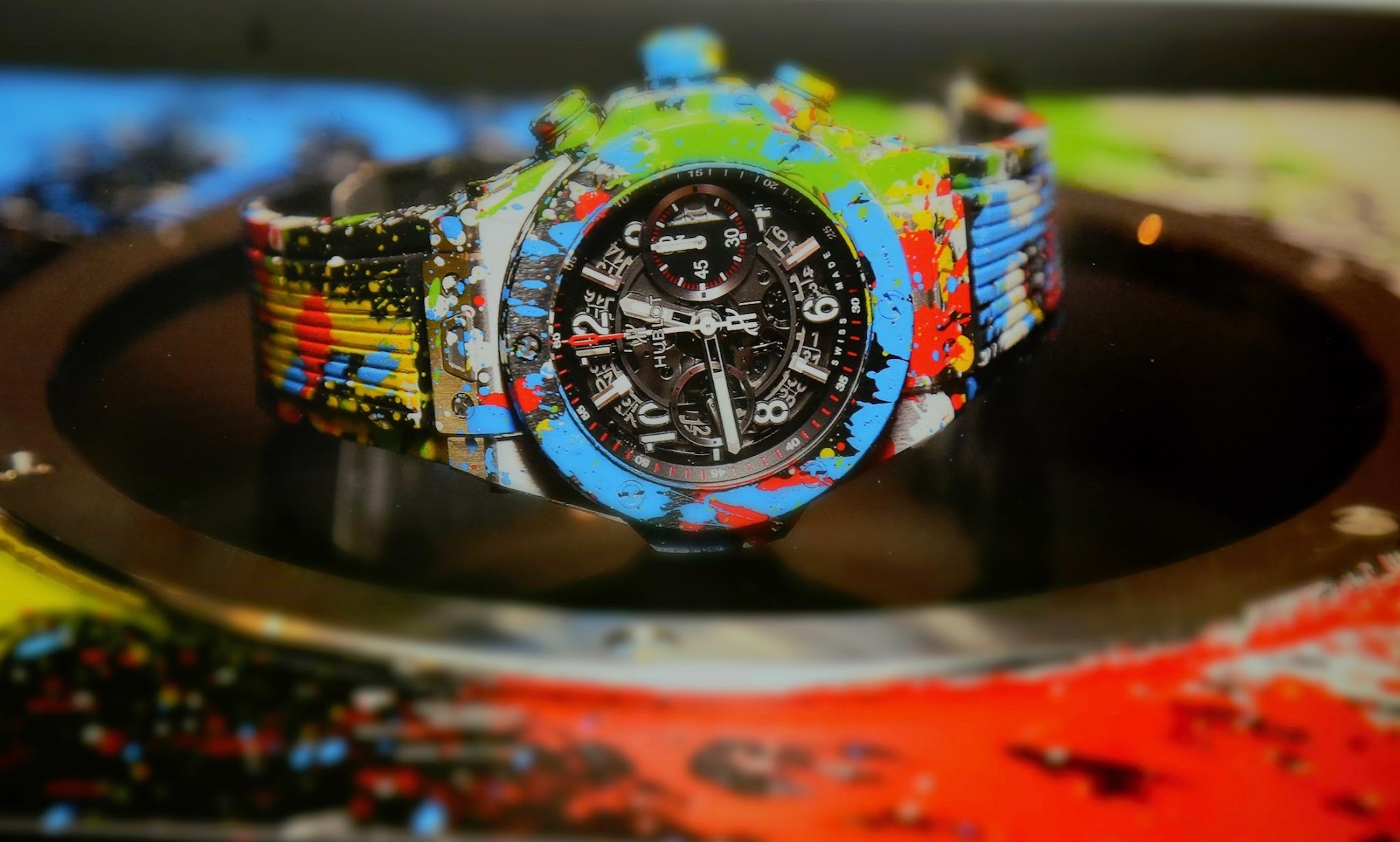 Hublot collaborates with Mr Brainwash through a luxury watch covered in multicoloured paint splashes inspired by pop street art.